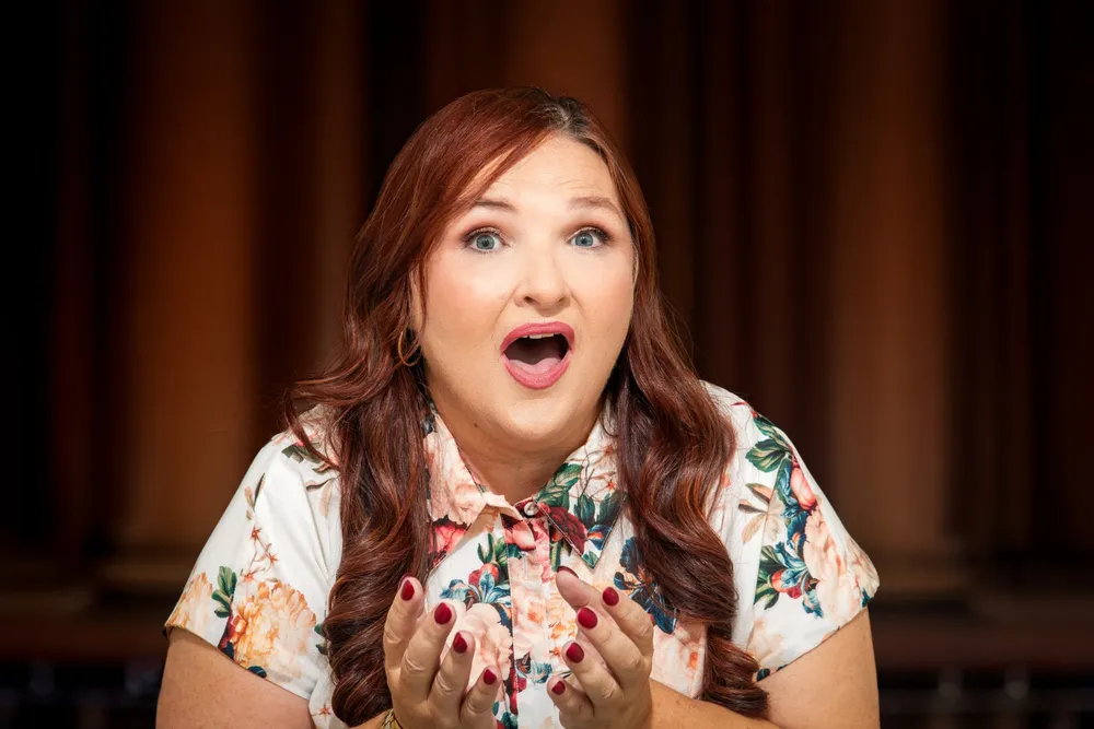 Jodi Cassaniti mid-phrase, singing
